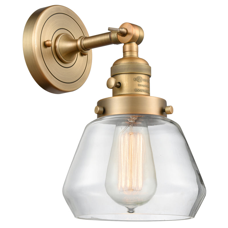 Fulton Sconce shown in the Brushed Brass finish with a Clear shade