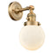 Beacon Sconce shown in the Brushed Brass finish with a Matte White shade