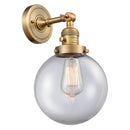 Beacon Sconce shown in the Brushed Brass finish with a Clear shade