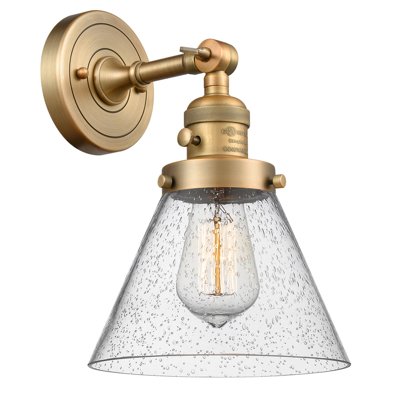 Cone Sconce shown in the Brushed Brass finish with a Seedy shade