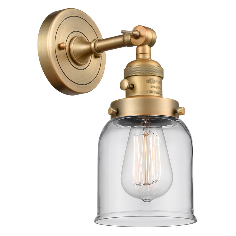 Bell Sconce shown in the Brushed Brass finish with a Clear shade