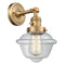 Oxford Sconce shown in the Brushed Brass finish with a Clear shade