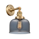 Innovations Lighting Large Bell 1-100 watt 8 inch Brushed Brass Sconce with Smoked glass and Solid Brass 180 Degree Adjustable Swivel With Engraved Cast Cup Includes a "High-Low-Off" Switch. 203SWBBG73