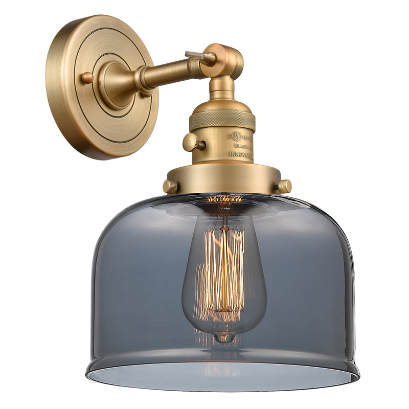 Bell Sconce shown in the Brushed Brass finish with a Plated Smoke shade