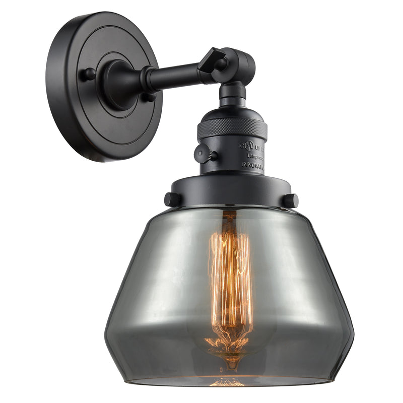 Fulton Sconce shown in the Matte Black finish with a Plated Smoke shade