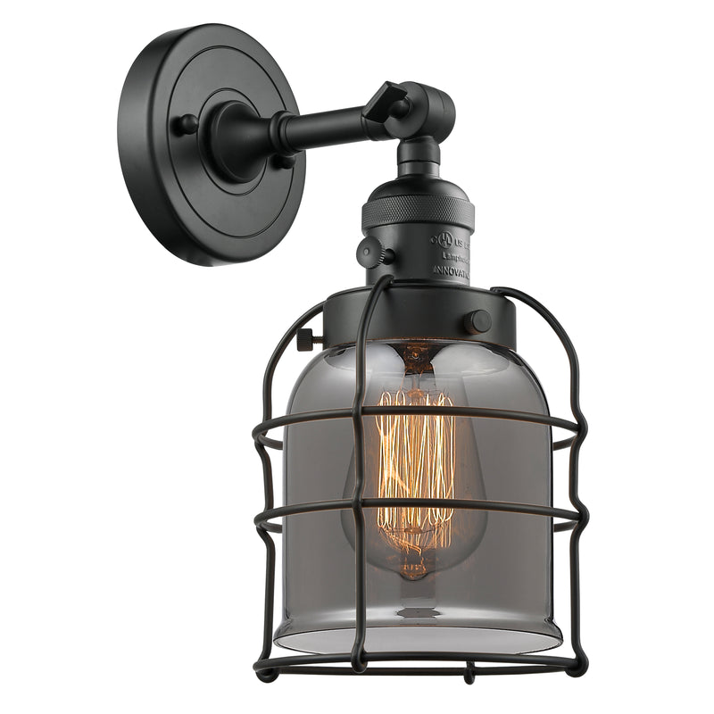 Bell Cage Sconce shown in the Matte Black finish with a Plated Smoke shade