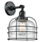 Bell Cage Sconce shown in the Matte Black finish with a Seedy shade