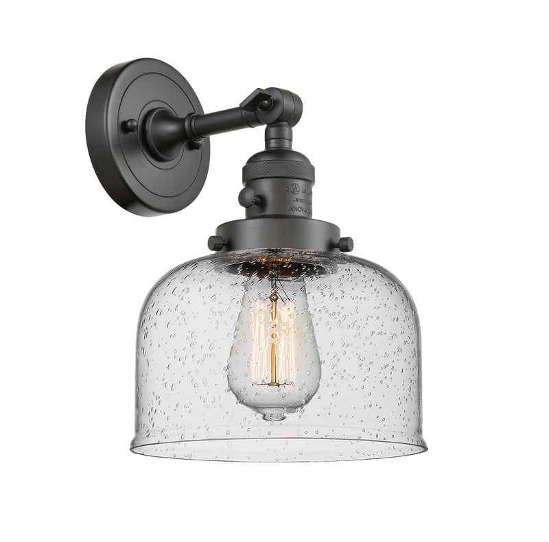 Innovations Lighting Large Bell 1-100 watt 8 inch Oil Rubbed Bronze Sconce with Seedy glass and Solid Brass 180 Degree Adjustable Swivel With Engraved Cast Cup Includes a "High-Low-Off" Switch. 203SWOBG74