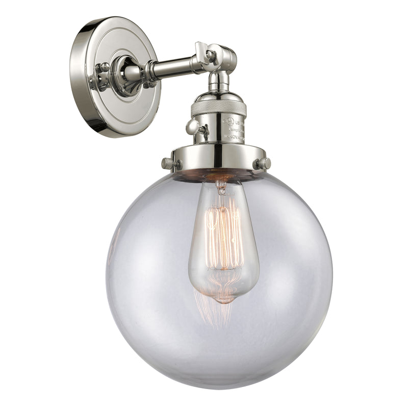 Beacon Sconce shown in the Polished Nickel finish with a Clear shade