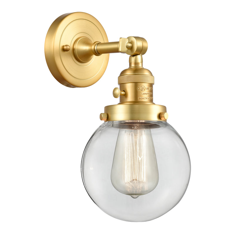 Beacon Sconce shown in the Satin Gold finish with a Clear shade