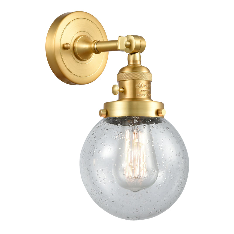 Beacon Sconce shown in the Satin Gold finish with a Seedy shade