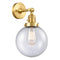 Beacon Sconce shown in the Satin Gold finish with a Seedy shade