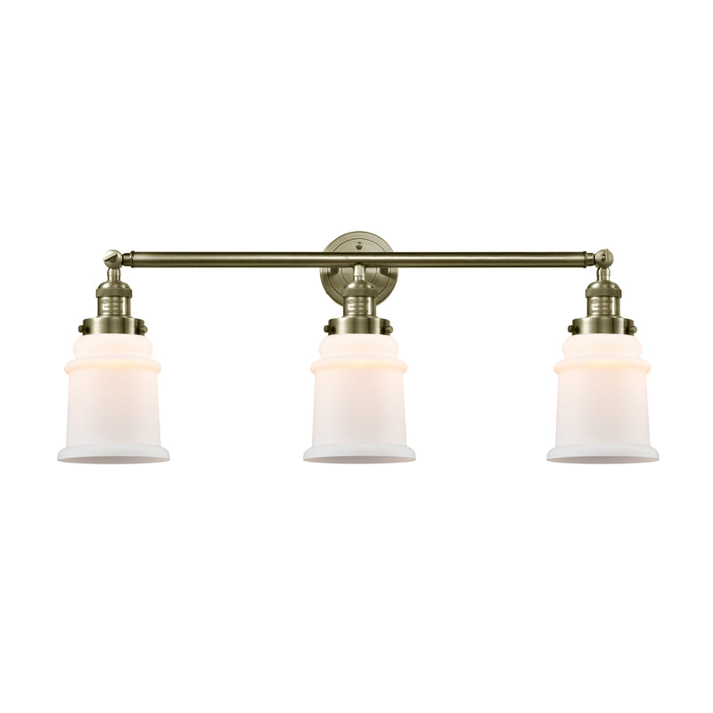Canton Bath Vanity Light shown in the Antique Brass finish with a Matte White shade