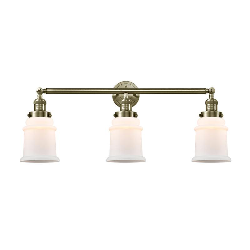 Canton Bath Vanity Light shown in the Antique Brass finish with a Matte White shade