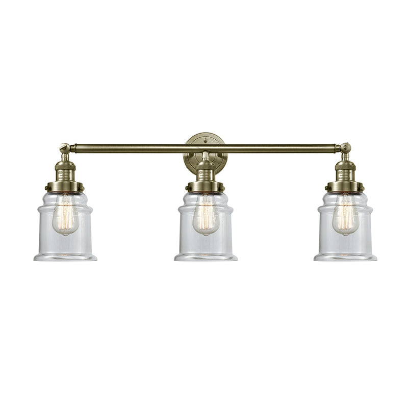 Canton Bath Vanity Light shown in the Antique Brass finish with a Clear shade