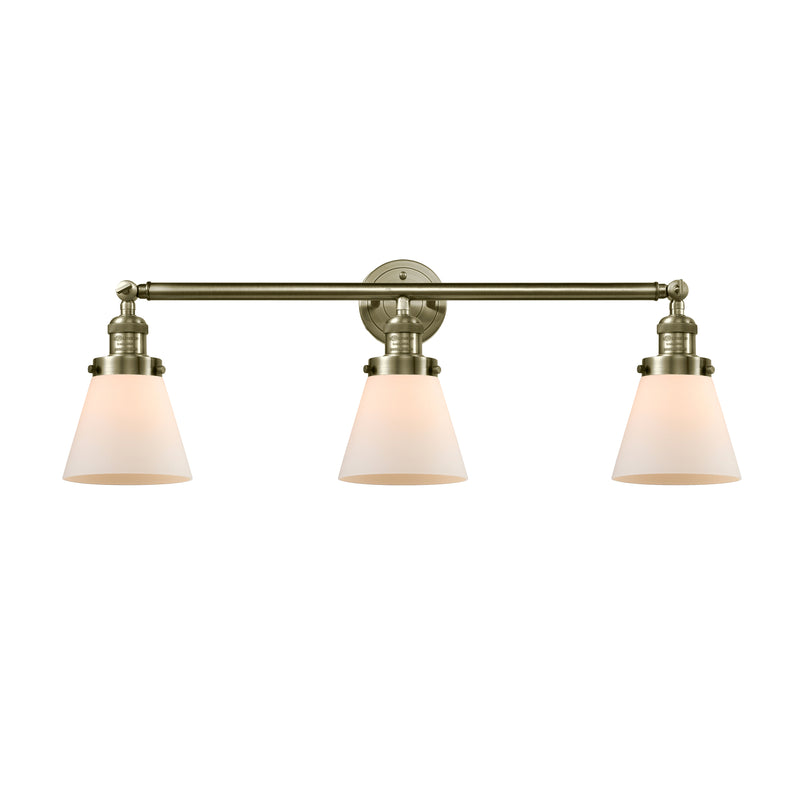 Cone Bath Vanity Light shown in the Antique Brass finish with a Matte White shade
