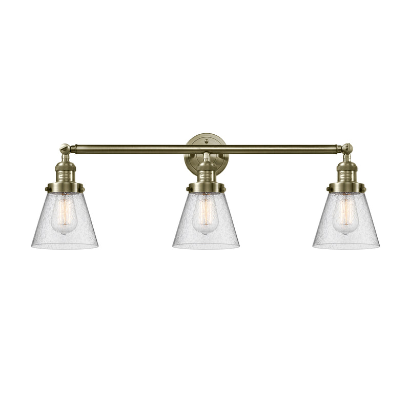 Cone Bath Vanity Light shown in the Antique Brass finish with a Seedy shade