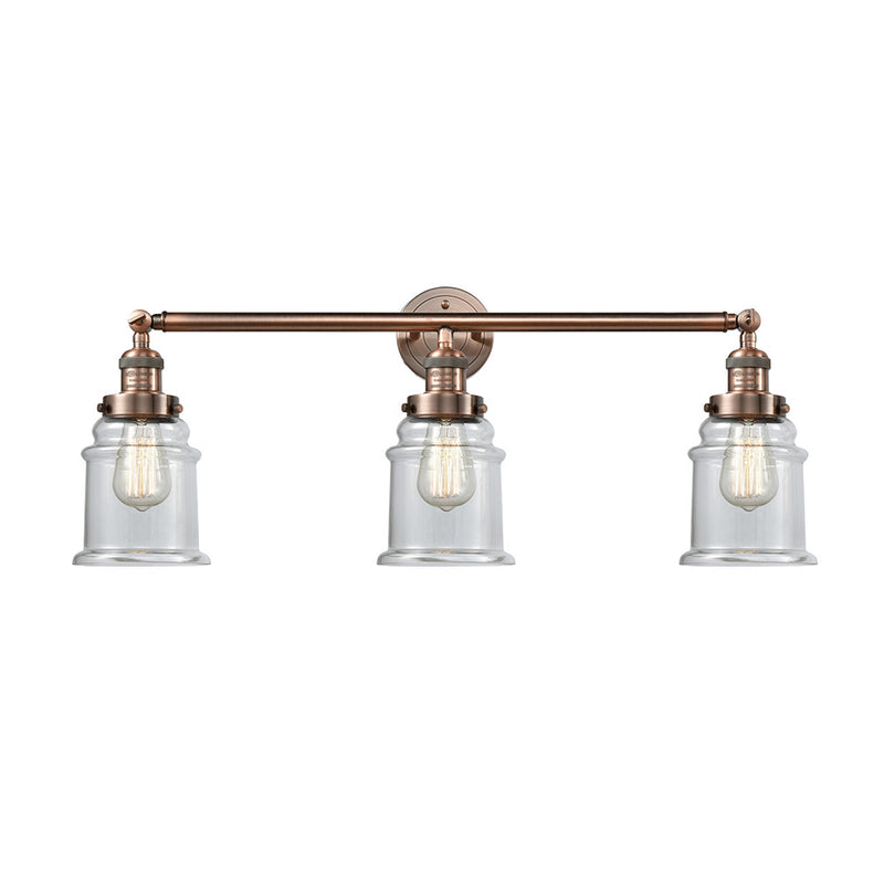 Canton Bath Vanity Light shown in the Antique Copper finish with a Clear shade