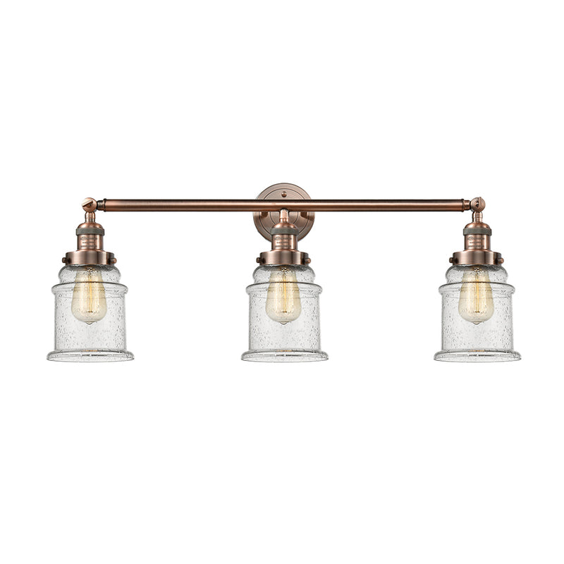 Canton Bath Vanity Light shown in the Antique Copper finish with a Seedy shade
