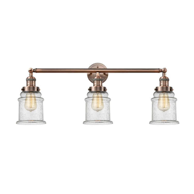Canton Bath Vanity Light shown in the Antique Copper finish with a Seedy shade