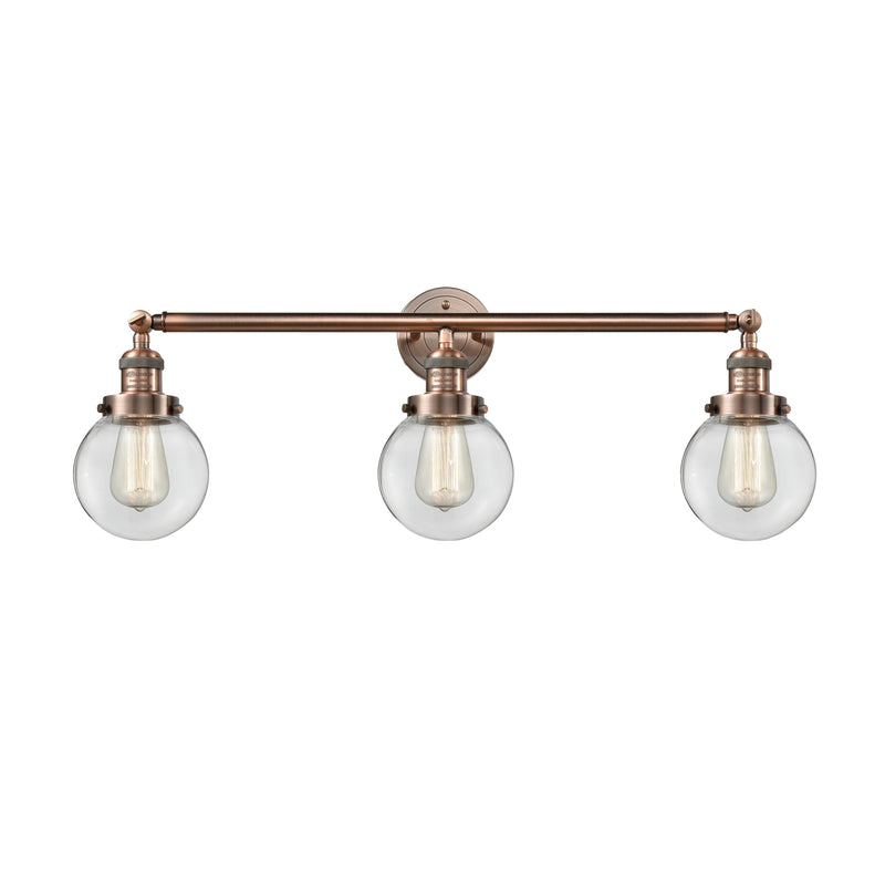 Beacon Bath Vanity Light shown in the Antique Copper finish with a Clear shade