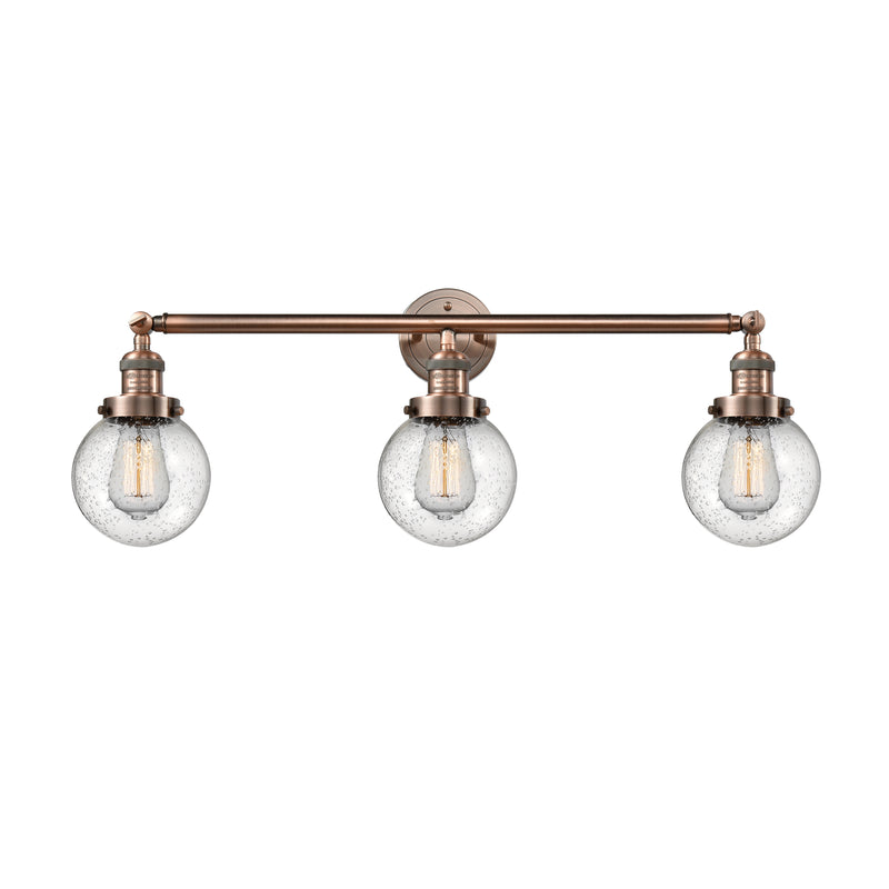 Beacon Bath Vanity Light shown in the Antique Copper finish with a Seedy shade