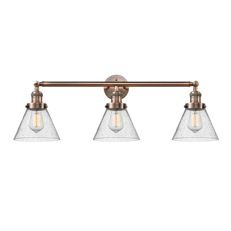 Cone Bath Vanity Light shown in the Antique Copper finish with a Seedy shade
