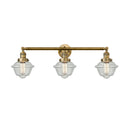 Oxford Bath Vanity Light shown in the Brushed Brass finish with a Seedy shade