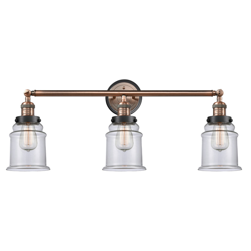 Canton Bath Vanity Light shown in the Antique Copper finish with a Clear shade