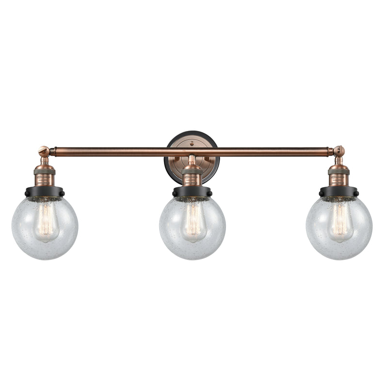 Beacon Bath Vanity Light shown in the Antique Copper finish with a Seedy shade