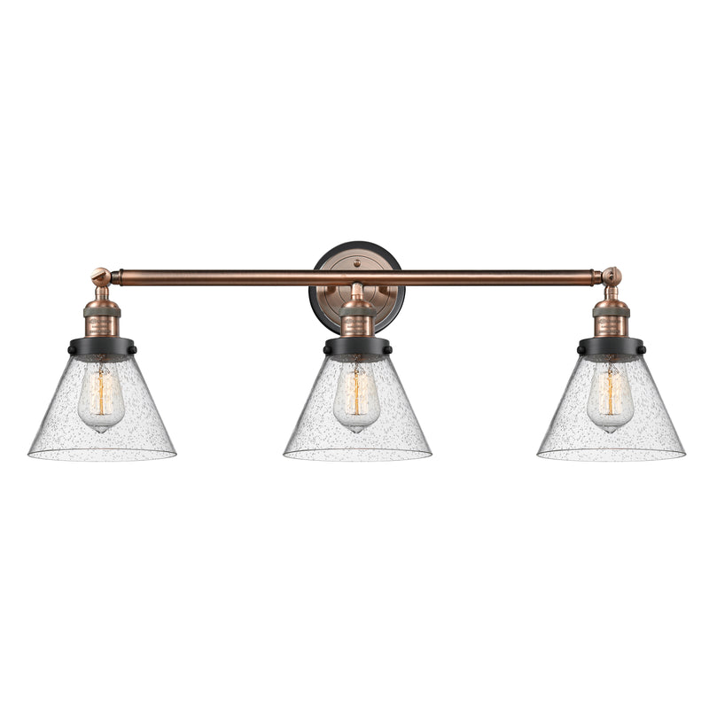 Cone Bath Vanity Light shown in the Antique Copper finish with a Seedy shade