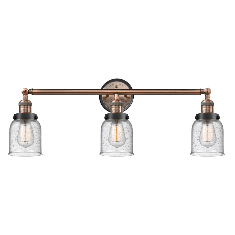 Bell Bath Vanity Light shown in the Antique Copper finish with a Seedy shade