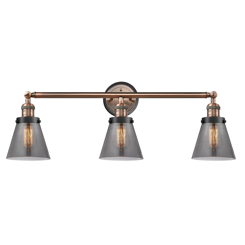 Cone Bath Vanity Light shown in the Antique Copper finish with a Plated Smoke shade
