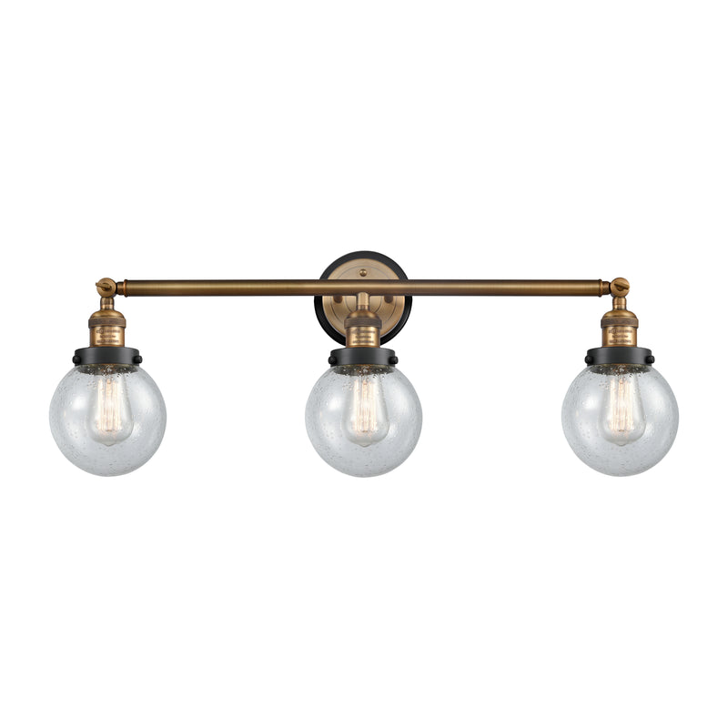 Beacon Bath Vanity Light shown in the Brushed Brass finish with a Seedy shade