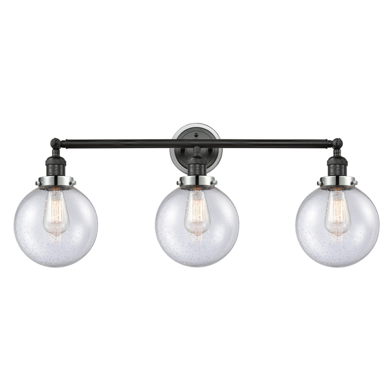 Beacon Bath Vanity Light shown in the Matte Black finish with a Seedy shade