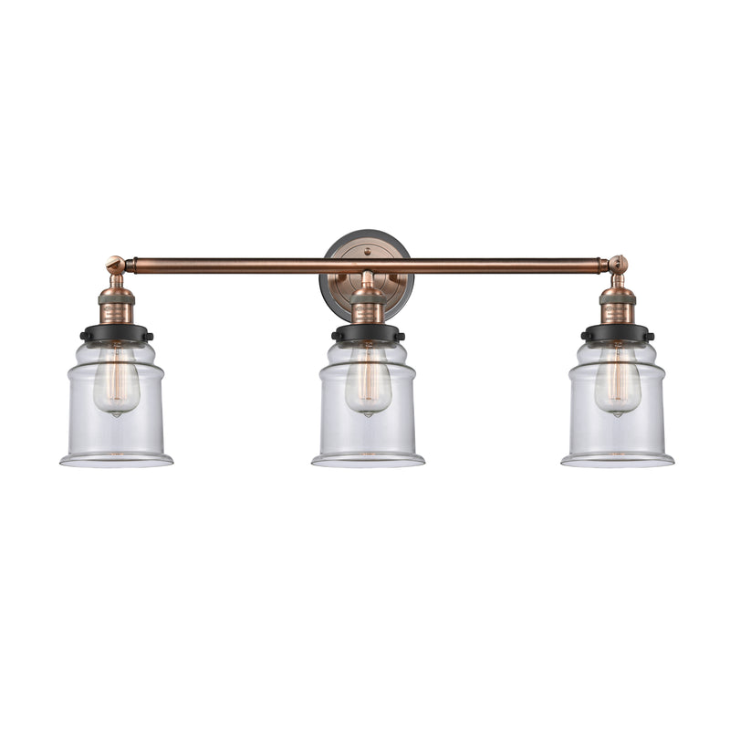 Canton Bath Vanity Light shown in the Antique Copper finish with a Clear shade