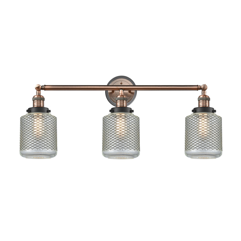 Stanton Bath Vanity Light shown in the Antique Copper finish with a Clear Wire Mesh shade