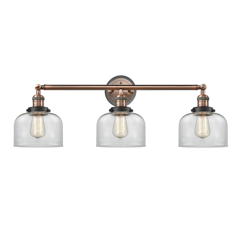 Bell Bath Vanity Light shown in the Antique Copper finish with a Clear shade