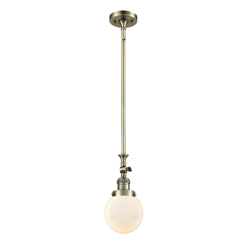 Beacon Mini Pendant shown in the Antique Brass finish with a Matte White shade