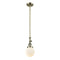 Beacon Mini Pendant shown in the Antique Brass finish with a Matte White shade