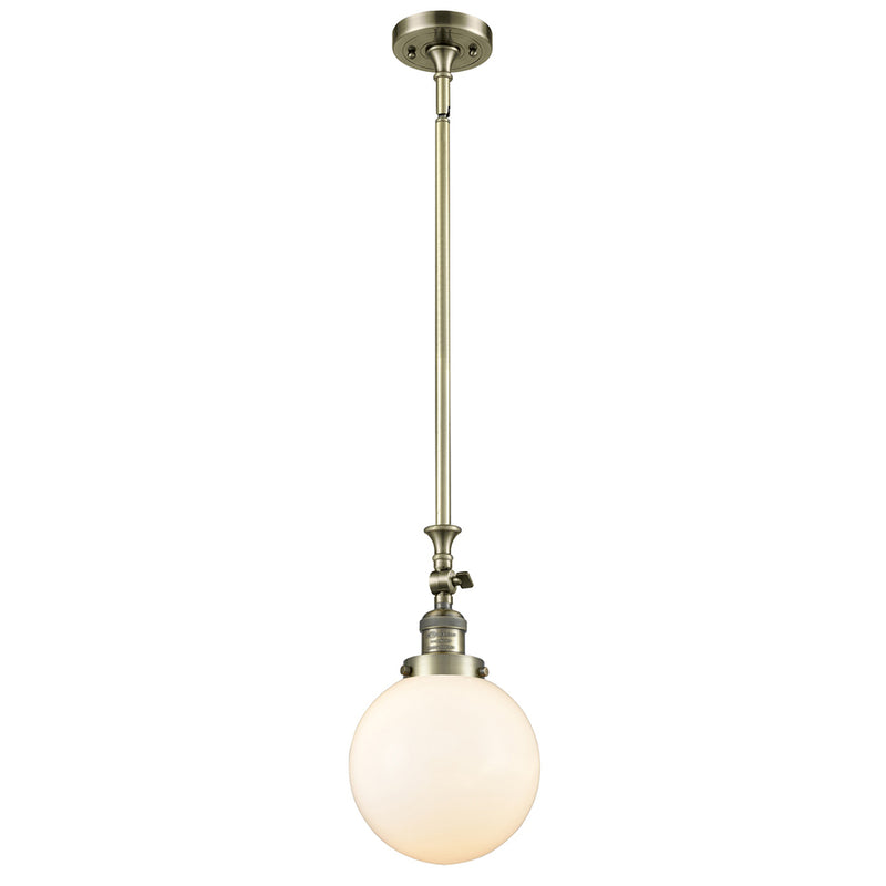 Beacon Mini Pendant shown in the Antique Brass finish with a Matte White shade