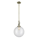 Beacon Mini Pendant shown in the Antique Brass finish with a Clear shade