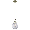 Beacon Mini Pendant shown in the Antique Brass finish with a Clear shade