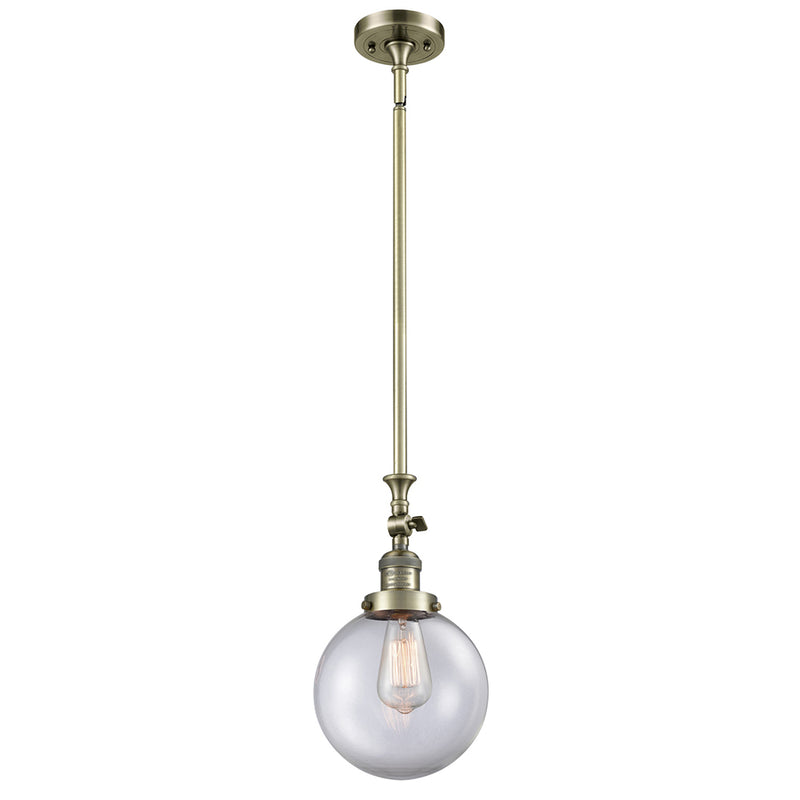 Beacon Mini Pendant shown in the Antique Brass finish with a Clear shade