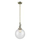 Beacon Mini Pendant shown in the Antique Brass finish with a Seedy shade