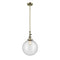 Beacon Mini Pendant shown in the Antique Brass finish with a Seedy shade