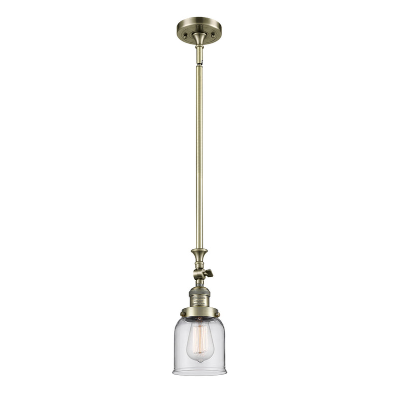 Bell Mini Pendant shown in the Antique Brass finish with a Clear shade