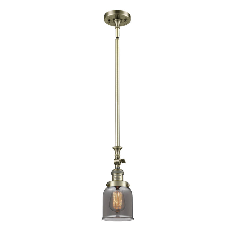 Bell Mini Pendant shown in the Antique Brass finish with a Plated Smoke shade