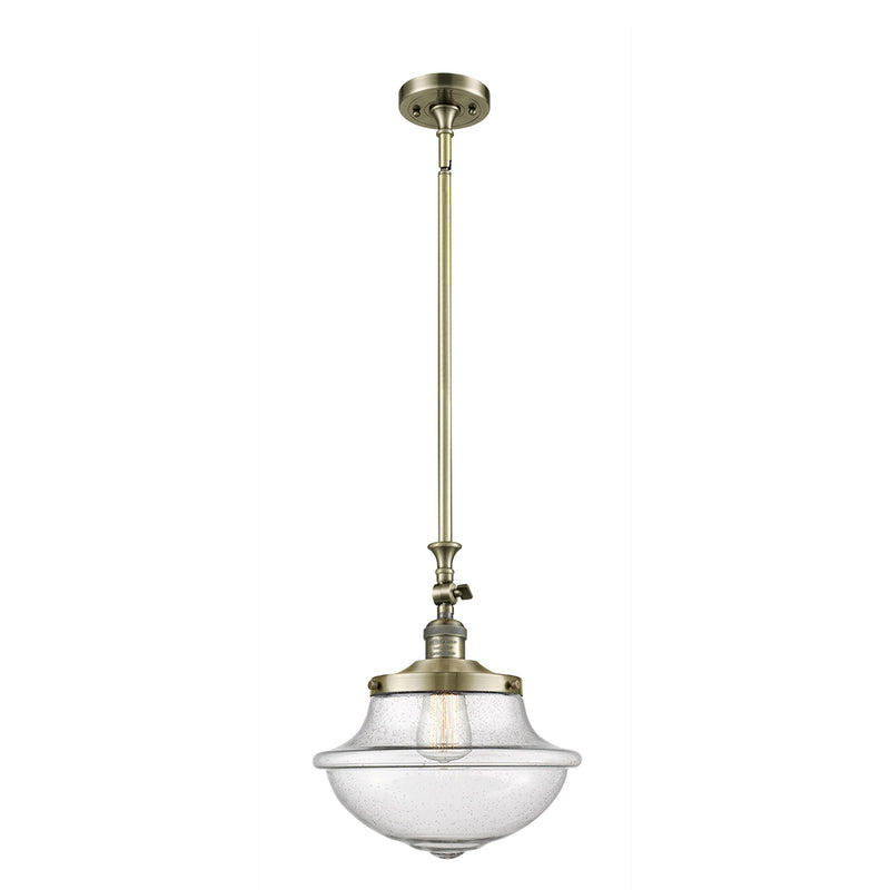 Oxford Mini Pendant shown in the Antique Brass finish with a Seedy shade