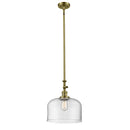 Bell Mini Pendant shown in the Antique Brass finish with a Clear shade